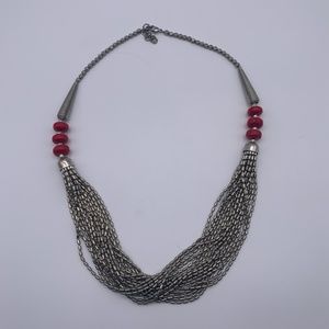 Intricate Silver Beaded Necklace with Red Accent